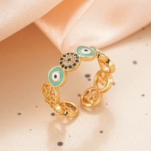 Detail of 18K gold ring featuring turquoise enamel evil eye and sparkling zircon stones