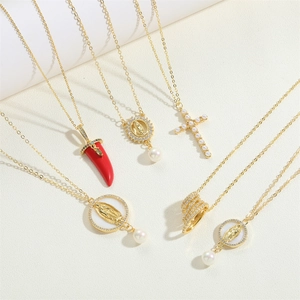 Gold-plated necklaces featuring Virgin Mary, red chili pendant, and pearl cross charms