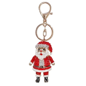 Detail of Santa Claus keychain with red and white rhinestones on a gold clasp