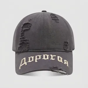 Detail of vintage grey cotton kids baseball cap with distressed rips and embroidery