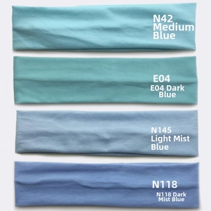 Detail of four blue knitted sports headbands in different shades with seamless texture