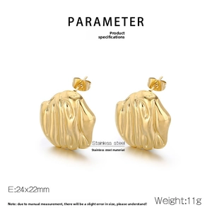 Macro view of gold stainless steel earrings featuring irregular molten lava textures