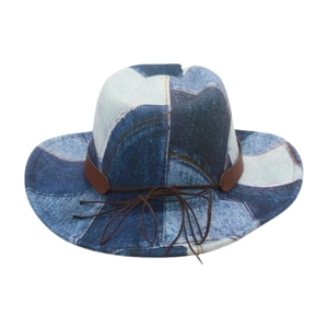Detail of patchwork denim fedora with brown leather band and intricate stitching