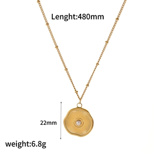 Golden titanium steel necklace with starfish pendant and white pearl on white background