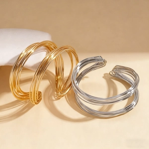 Minimalist geometric twisted multilayer metal cuff bracelet in gold and silver finish