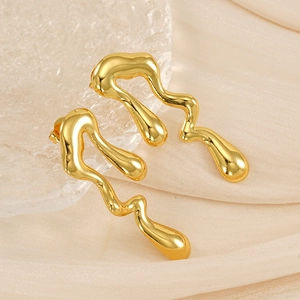 18K gold-plated stainless steel teardrop earrings on elegant beige silk and textured glass