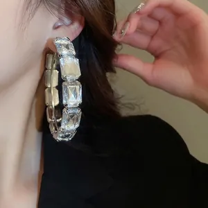 Chunky silver square hoop earrings with emerald cut clear crystals in a glamourous design