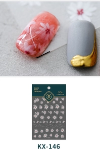 Detail of KX-146 nail stickers featuring delicate white and pink floral patterns and lines