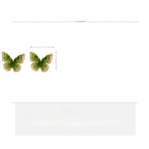 Detailed view of butterfly earrings with green zircon crystals and golden borders