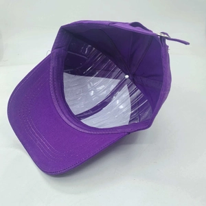 Internal view of purple cotton baseball cap showing neat stitching and metal buckle