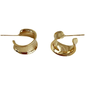 Polished gold wide wave C-shaped hoop earrings with minimalist geometric design