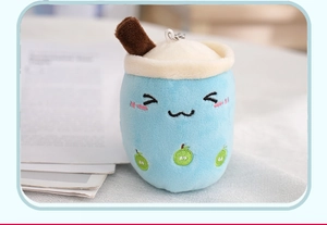Close-up of sky blue plush bubble tea keychain with fruit embroidery and metal hook