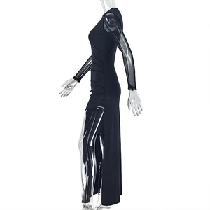 Detail view of the side slit and sheer mesh long sleeves on this black slim fit dress