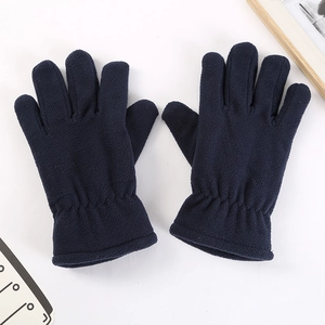 Macro detail of dark blue fleece fabric and elastic wrist cuff on winter thermal gloves