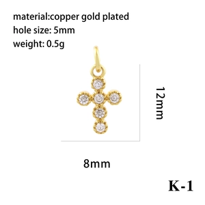 Detail of micro-pave 18K gold plated copper cross pendant with size and weight specs