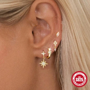 Elegant gold S925 sterling silver earring set featuring sparkling star and moon designs