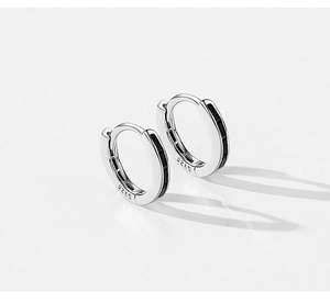 Macro shot of S925 sterling silver hoop earrings with black enamel inlay stripes