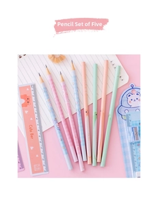 Flat lay of pink school stationery set with cartoon pencils and cute bear ruler