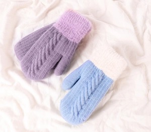 Detail of cable knit winter gloves with plush faux fur cuffs in purple and blue
