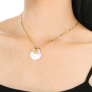 18K gold plated ocean series necklace with starfish and white shell pendant on neck