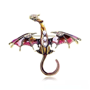 Detailed view of flying dragon brooch with purple enamel and sparkling rhinestones