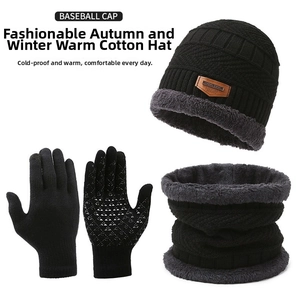 Close-up of black winter knitted hat, neck warmer, and touchscreen gloves with fleece lining