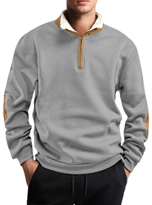 Detail of grey quarter-zip sweatshirt showing brown collar trim and sherpa fleece lining
