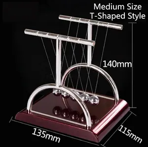 Macro detail of T-shaped Newton's cradle with wood-grain base and metal pendulum balls