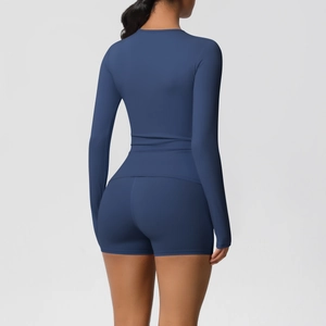 Back view of a navy blue long-sleeve yoga set featuring high-waisted fitness shorts