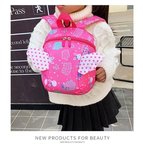 Side view of toddler backpack featuring pink rabbit print and 3D white wings