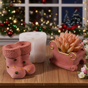 Detail showing silicone mold and pink plaster Christmas boot and sleigh shaped flower pots