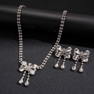 Elegant silver bow jewelry set with shimmering rhinestones and tassel water drop pendant
