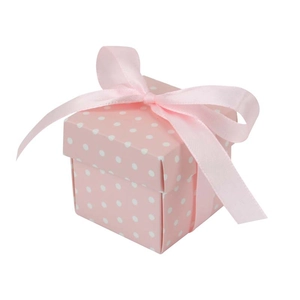 Pink polka dot square candy gift box with elegant silk ribbon bow on white background