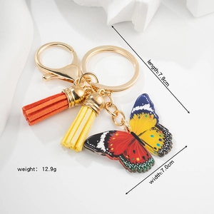 Porte-clés papillon coloré avec pompons, longueur de 7,9 cm et poids de 12,9 g
