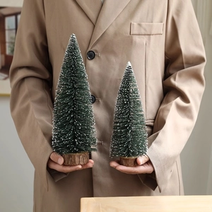 Mini flocked Christmas trees with snow effect and wooden bases in two sizes for table decor