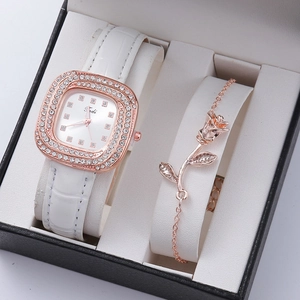 Close-up of diamond square watch and rose gold bracelet set in black gift box