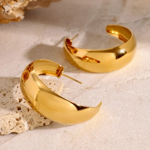 Polished 18k gold plated stainless steel chunky C-shaped hoop earrings on stone