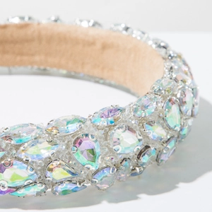 Macro detail of luxury baroque headband with multi-colored crystals and silver metal claw settings