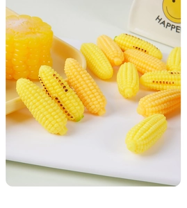 Close-up of realistic resin corn models with grilled texture for DIY crafts