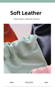Close-up of soft leather toiletry bag with fine texture and durable stitching detail