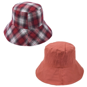 Close-up detailed view of a reversible plaid and solid color cotton bucket hat for women