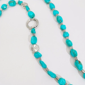 Ethnic turquoise beaded crossbody phone chain with silver religious pendants and spring clasp