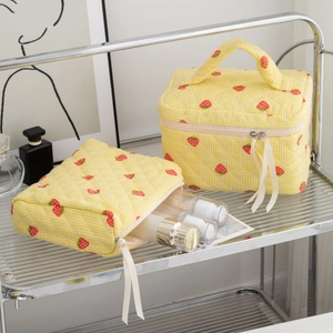 Quilted yellow checkered cosmetic bag set with red strawberry print and ribbon detail