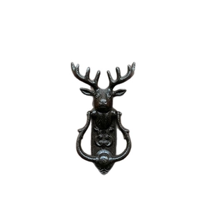Vintage cast iron stag head door knocker with embossed texture in rustic bronze finish