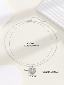 Detail of silver swan heart necklace with dimensions 2x2.3cm and 45-50cm chain length