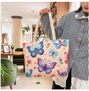 Close-up of bohemian floral canvas tote bag featuring vibrant butterfly patterns