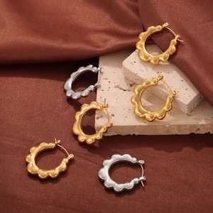 Minimalist gold and silver titanium steel hoop earrings with sun flower wavy edge design