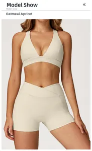 Detail view of oatmeal apricot sports set with V-neck bra and cross waist shorts