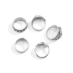 Five-piece set of vintage silver men's rings with antique totem and flame engravings