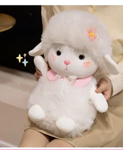 Close-up of a white lamb plush toy with pink crochet flowers and lace collar detail